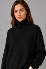 Women’s high neck knit jumper with a relaxed loose fit, cosy turtleneck, long sleeves and soft knitted finish for autumn and winter.