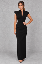 Women’s high V-neck sleeveless maxi dress with a sleek sheath silhouette, solid-colour finish and elegant streamlined design.