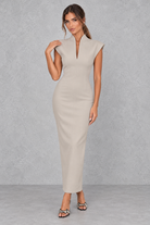 Women’s high V-neck sleeveless maxi dress with a sleek sheath silhouette, solid-colour finish and elegant streamlined design.