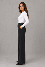 Women’s high waisted tailored trousers with a classic straight leg, clean minimalist finish and elegant smart fit for work and everyday styling.
