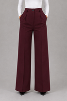 Women’s high waisted tailored trousers with a classic straight leg, clean minimalist finish and elegant smart fit for work and everyday styling.