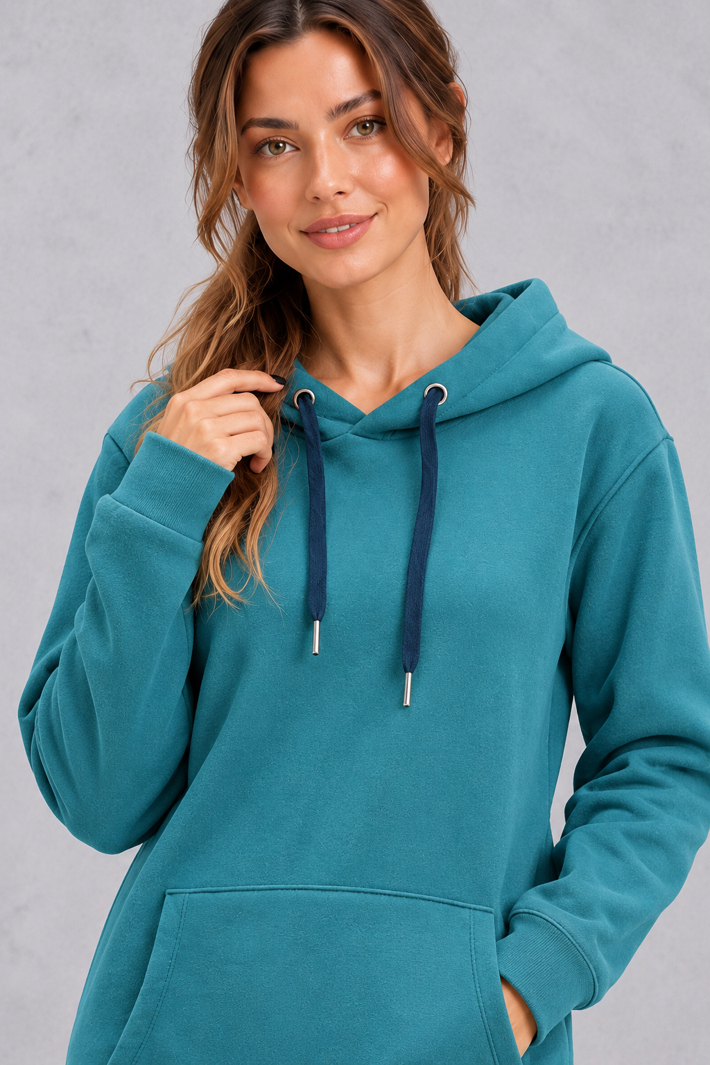 Women's teal hoodie dress – close-up of drawstring hood with navy cords and front pocket