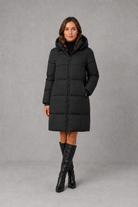 Women’s hooded puffer coat with lightweight insulated padding, structured hood and a flattering feminine silhouette for cold-weather wear.