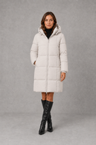 Women’s hooded puffer coat with lightweight insulated padding, structured hood and a flattering feminine silhouette for cold-weather wear.