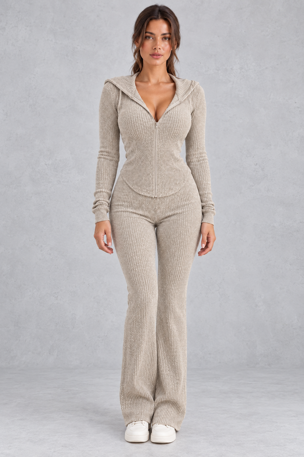 Women’s hooded ribbed knit co-ord set with a fitted zip-up top, long sleeves and matching flared trousers.