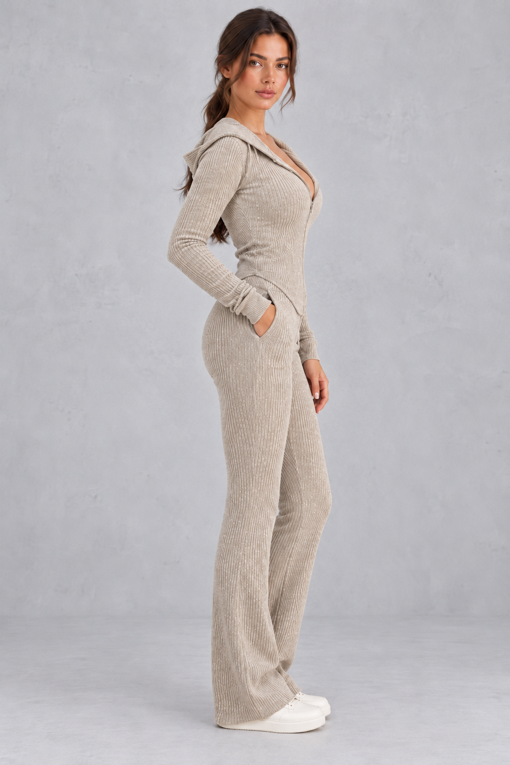 Women’s hooded ribbed knit co-ord set with a fitted zip-up top, long sleeves and matching flared trousers.