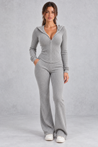 Women’s hooded ribbed knit co-ord set with a fitted zip-up top, long sleeves and matching flared trousers.