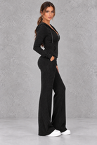 Women’s ribbed knit two-piece co-ord set with a fitted hooded zip-up top, adjustable drawstrings and matching wide leg trousers.