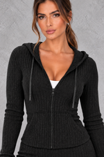 Women’s ribbed knit two-piece co-ord set with a fitted hooded zip-up top, adjustable drawstrings and matching wide leg trousers.