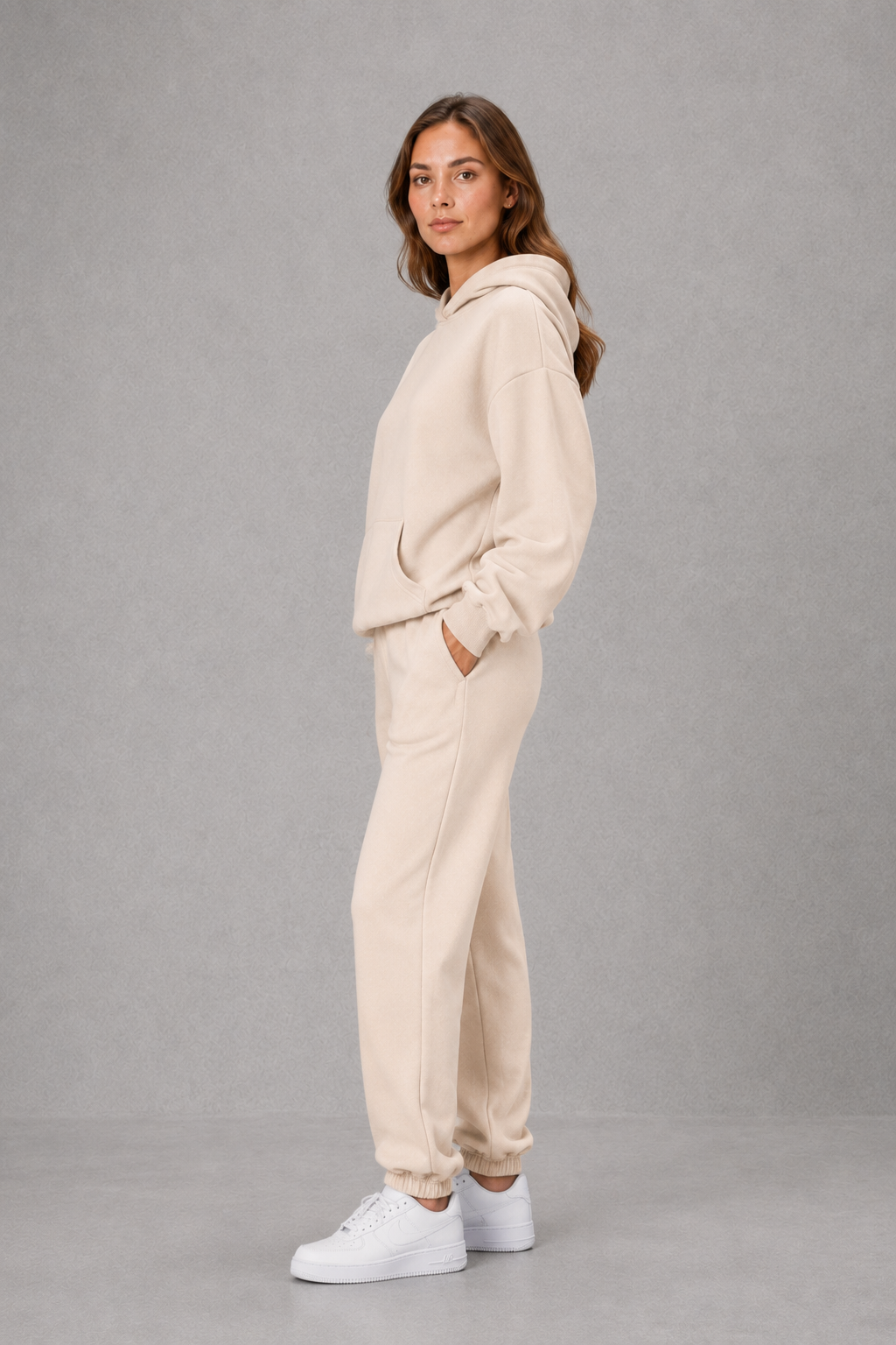 Women’s casual two piece tracksuit with relaxed drawstring hoodie and matching tapered cuffed joggers.