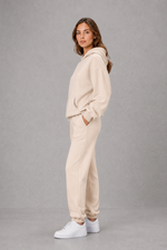 Women’s casual two piece tracksuit with relaxed drawstring hoodie and matching tapered cuffed joggers.