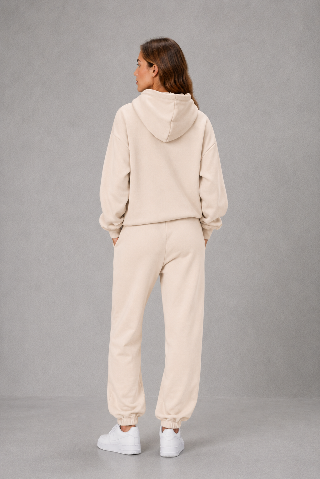 Women’s casual two piece tracksuit with relaxed drawstring hoodie and matching tapered cuffed joggers.