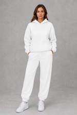 Women’s casual two piece tracksuit with relaxed drawstring hoodie and matching tapered cuffed joggers.