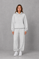 Women’s casual two piece tracksuit with relaxed drawstring hoodie and matching tapered cuffed joggers.