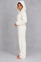 Women’s teddy fleece jumpsuit with a plush fluffy texture, large hood, full-length zip, long sleeves and relaxed one-piece silhouette.