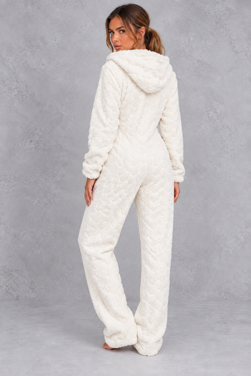Women’s teddy fleece jumpsuit with a plush fluffy texture, large hood, full-length zip, long sleeves and relaxed one-piece silhouette.