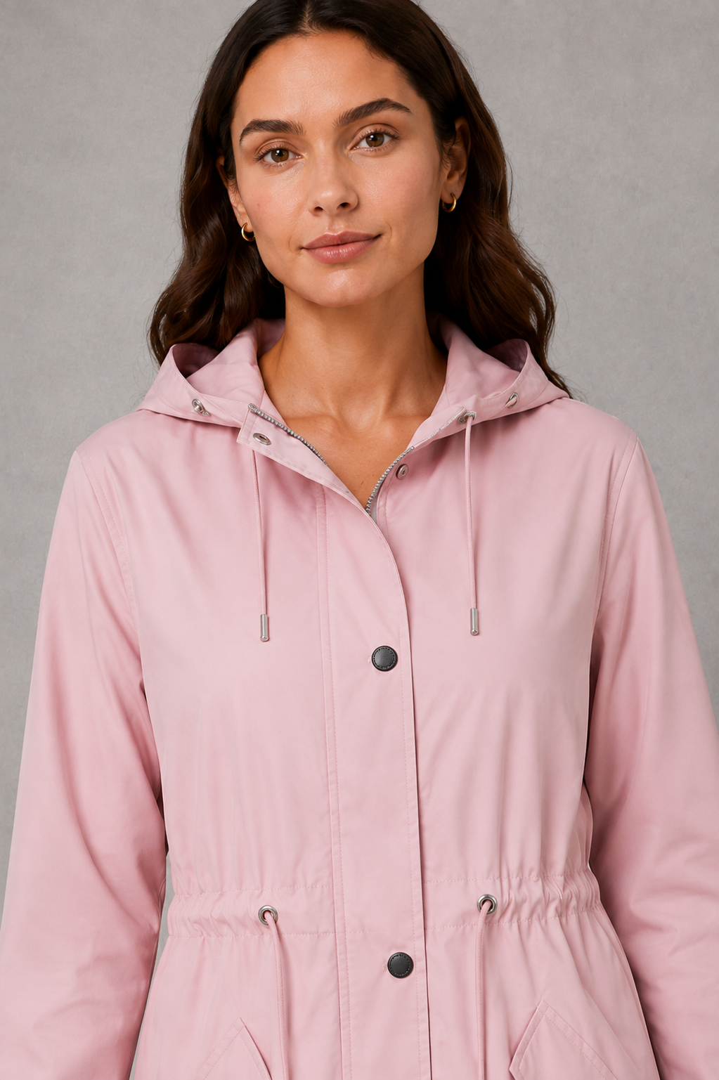 Women’s hooded water-resistant parka with an adjustable drawstring waist, longline fit, storm flap and practical front pockets.