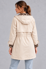 Women's cream hooded windproof jacket with drawstring waist – back view