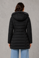 Women’s hooded long winter coat with a warm plush lining, softly tapered silhouette and elegant structured finish for cold-weather styling.