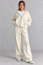 Women's cream zip-up hoodie and wide leg jogger set – front view
