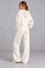 Women's cream zip-up hoodie and wide leg jogger set – back view