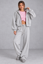 Women's grey zip-up hoodie and wide leg jogger set – front view