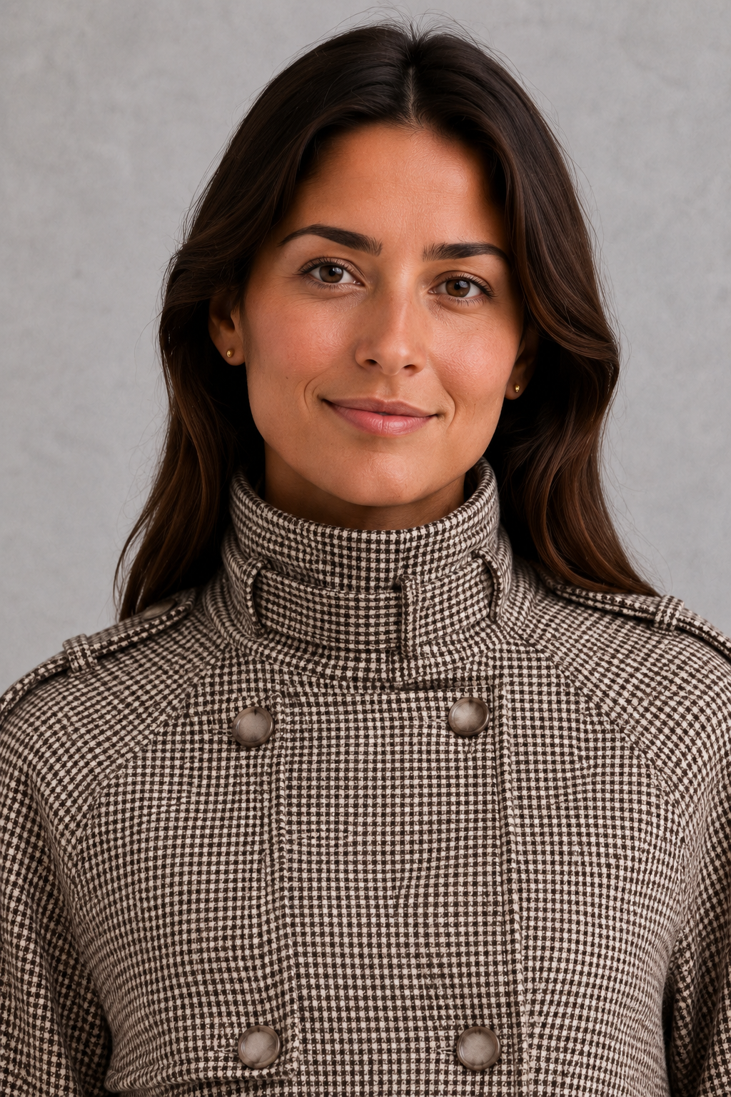 Women’s houndstooth button jacket with high neck and structured woven design.