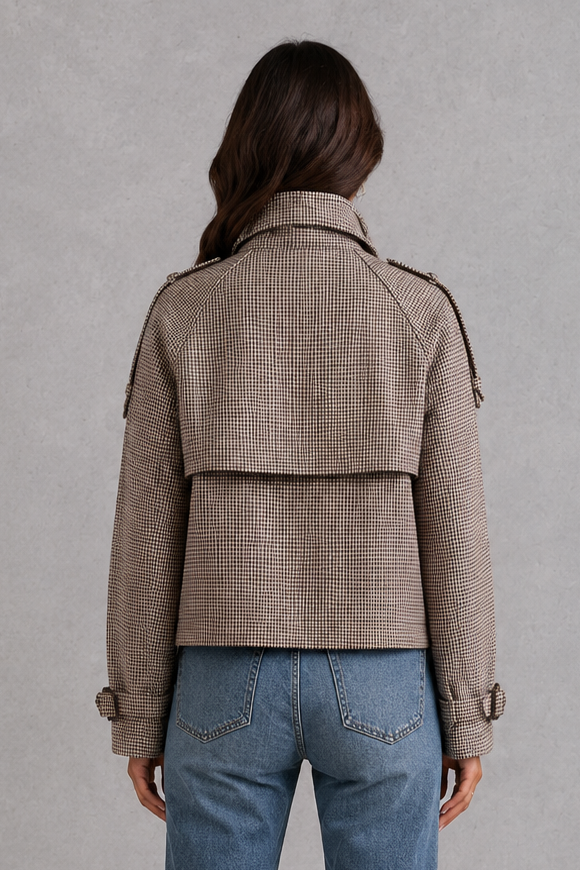 Women’s houndstooth button jacket with high neck and structured woven design.