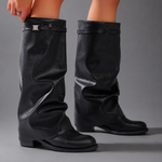Women’s knee-high slouch boots with pointed toe, low block heel and metal cuff detail.