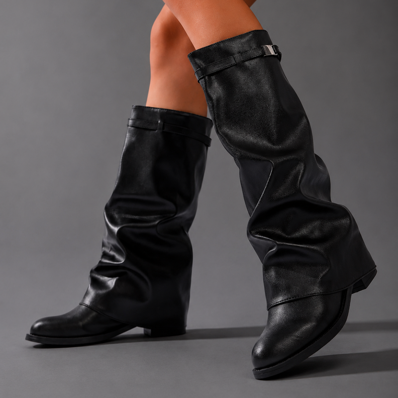 Women’s knee-high slouch boots with pointed toe, low block heel and metal cuff detail.
