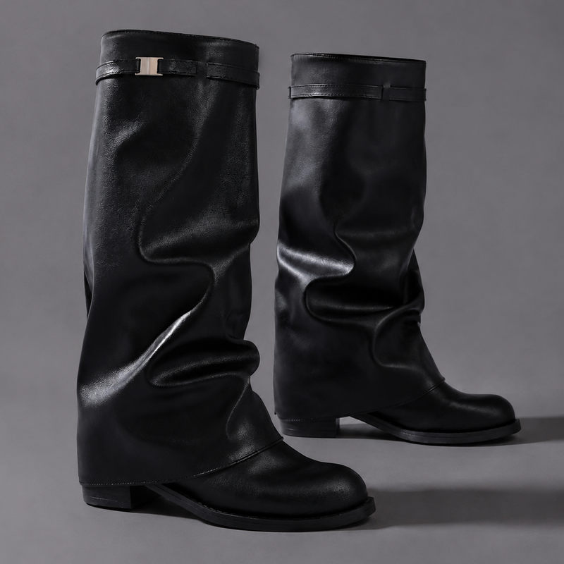 Women’s knee-high slouch boots with pointed toe, low block heel and metal cuff detail.