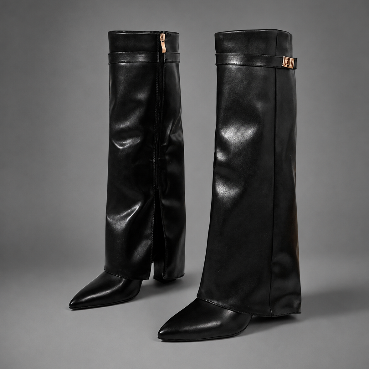 Women’s knee-high slouch boots with pointed toe, low block heel and metal cuff detail.