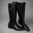 Women’s knee-high slouch boots with pointed toe, low block heel and metal cuff detail.