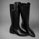 Women’s knee-high slouch boots with pointed toe, low block heel and metal cuff detail.