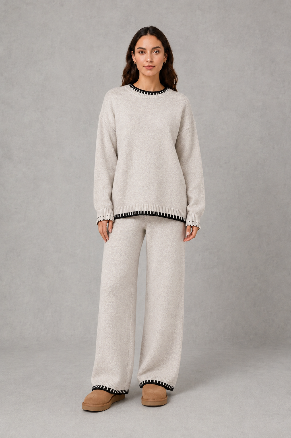 Women’s knitted co-ord set featuring a relaxed crew-neck jumper with contrast trim and matching wide leg knitted trousers.
