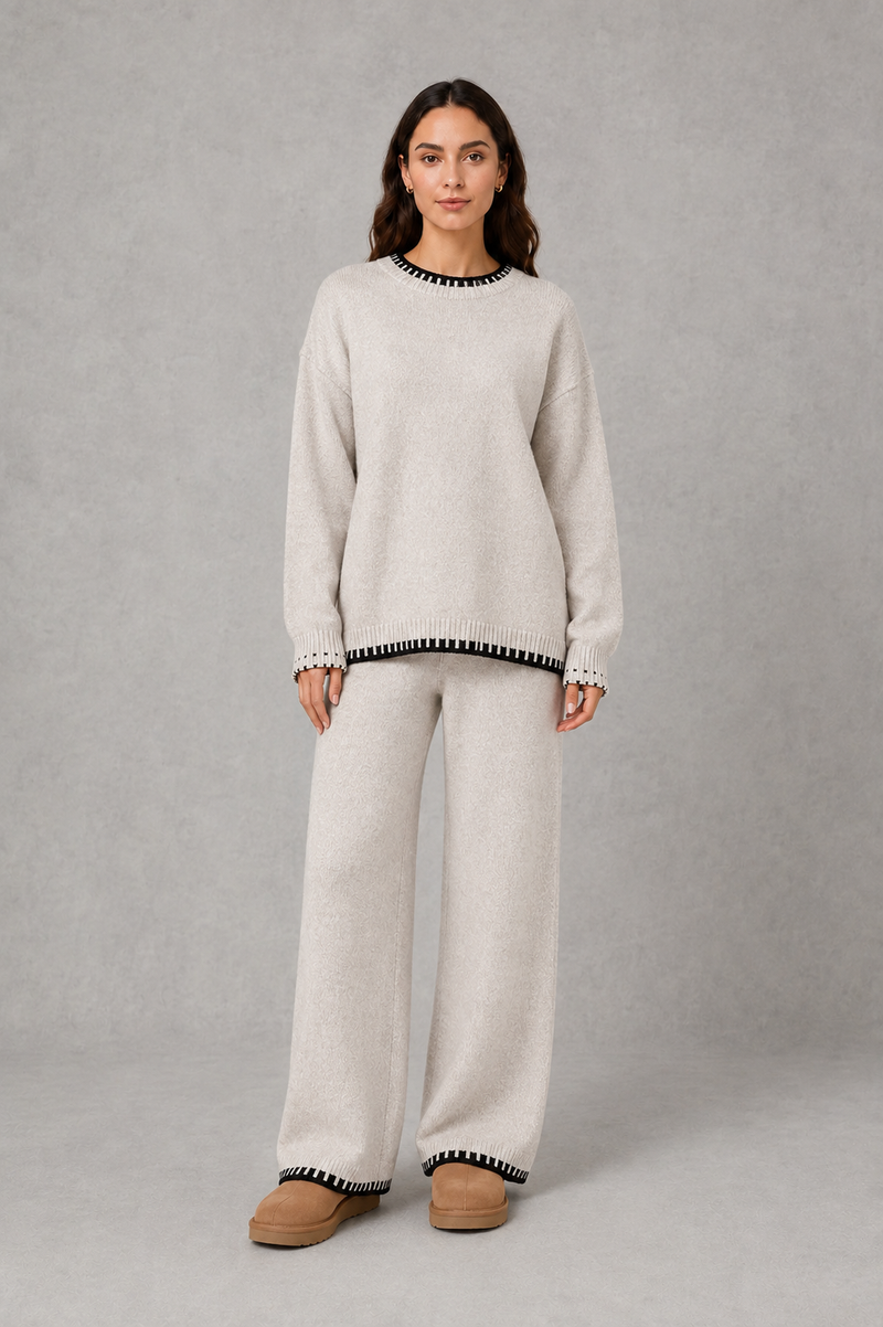 Women’s knitted co-ord set featuring a relaxed crew-neck jumper with contrast trim and matching wide leg knitted trousers.