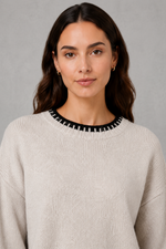 Women’s knitted co-ord set featuring a relaxed crew-neck jumper with contrast trim and matching wide leg knitted trousers.