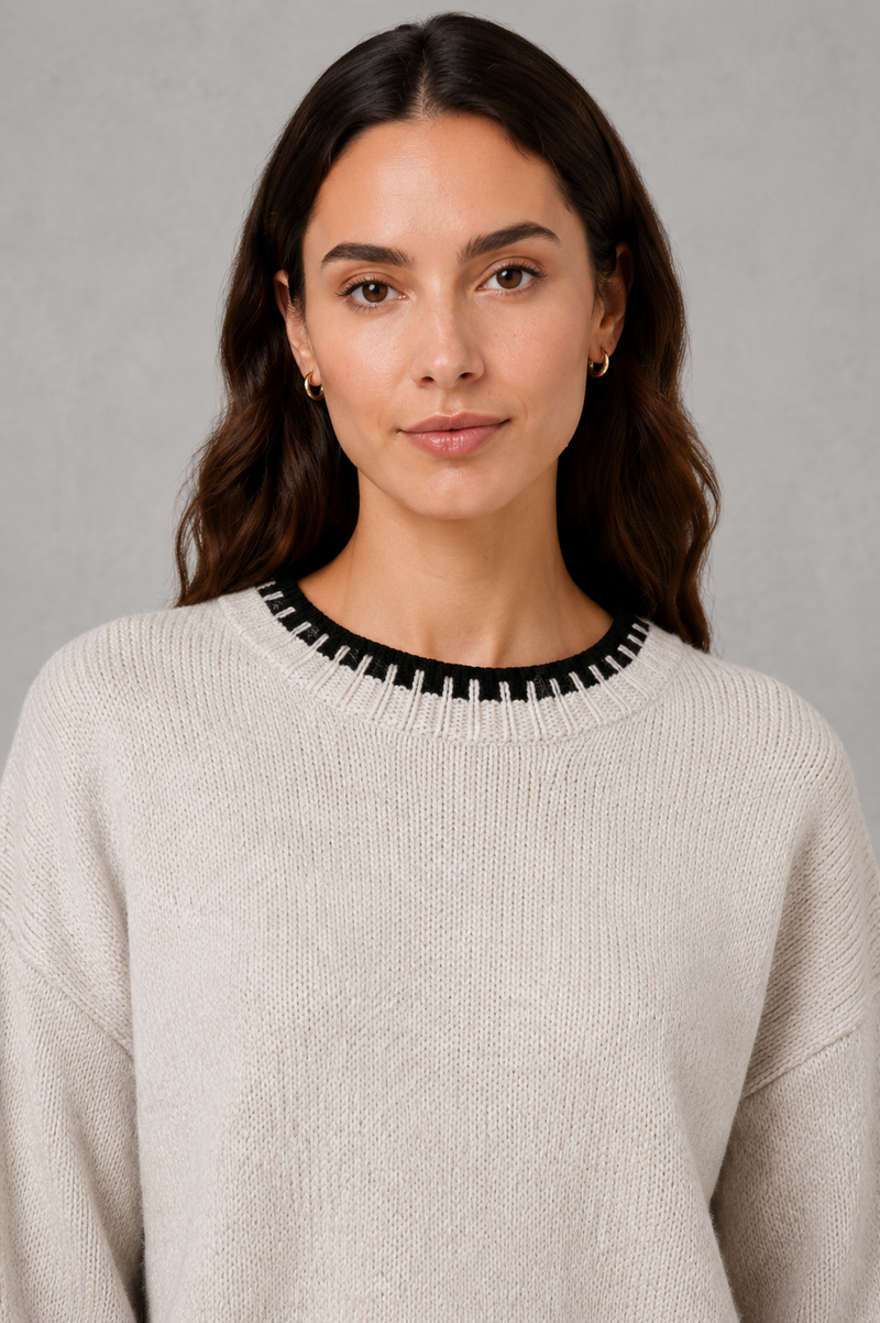 Women’s knitted co-ord set featuring a relaxed crew-neck jumper with contrast trim and matching wide leg knitted trousers.