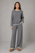 Women’s knitted co-ord set featuring a relaxed crew-neck jumper with contrast trim and matching wide leg knitted trousers.