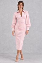 Women’s lapel pleated maxi dress with long sleeves, a tailored-inspired neckline and elegant flowing silhouette.