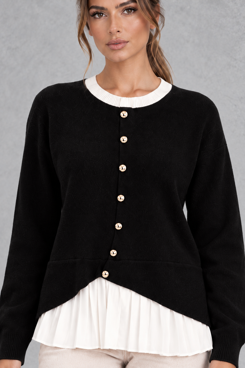 Women’s layered knit cardigan with a crew neckline, gold-tone button front, long sleeves and contrasting white pleated shirt-style hem.