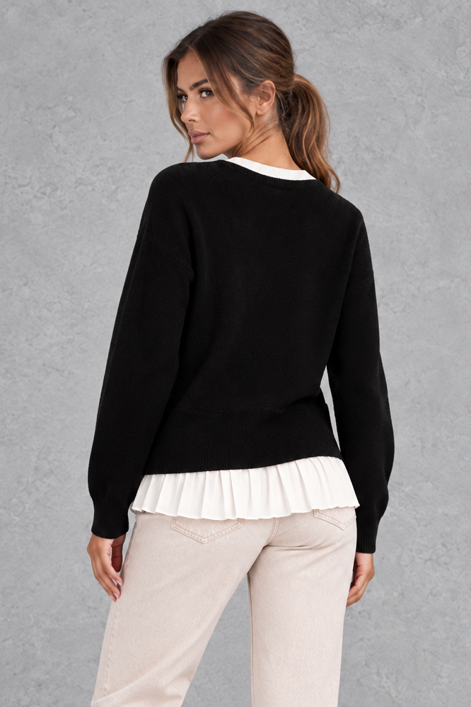 Women’s layered knit cardigan with a crew neckline, gold-tone button front, long sleeves and contrasting white pleated shirt-style hem.