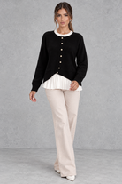 Women’s layered knit cardigan with a crew neckline, gold-tone button front, long sleeves and contrasting white pleated shirt-style hem.