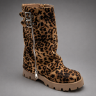 Women’s brown leather knee-high boots with double buckle details, long external zip and chunky sturdy sole.