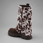 Women’s brown leather knee-high boots with double buckle details, long external zip and chunky sturdy sole.