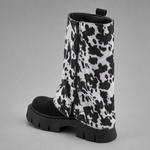 Women’s brown leather knee-high boots with double buckle details, long external zip and chunky sturdy sole.