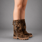 Women’s brown leather knee-high boots with double buckle details, long external zip and chunky sturdy sole.