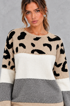 Women’s leopard print knit jumper with neutral colour-block panels, a wide crew neckline, dropped shoulders and relaxed silhouette.