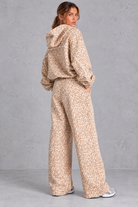 Women's cream leopard print hoodie and wide leg jogger set – back view showing hood and piping