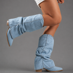 Women’s light blue denim knee-high boots with ruched shafts, pointed toes and square block heels.